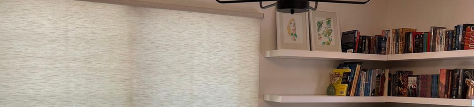Close-up of elegant sheer window shades and contemporary furniture in sunlit San Mateo home