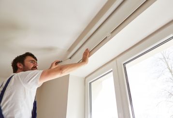 Cordless blinds and shades installed on a window, showcasing their ease of use and versatility.