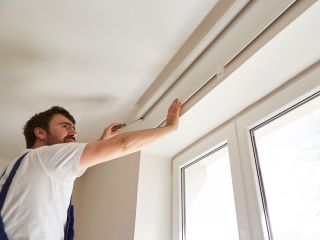 Cordless blinds and shades installed on a window, showcasing their ease of use and versatility.